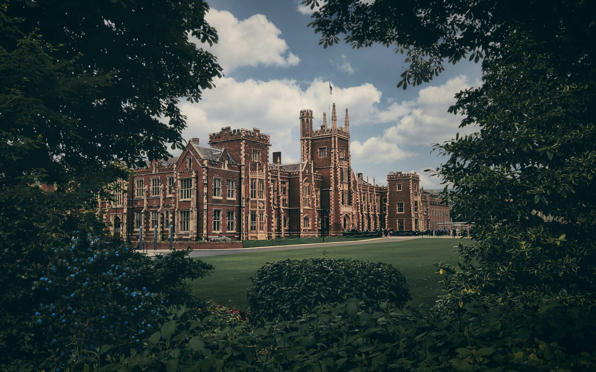A historic red-brick estate behind manicured gardens