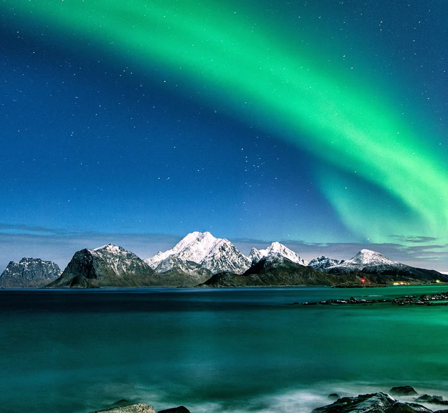 Northern lights over a Nordic fjord